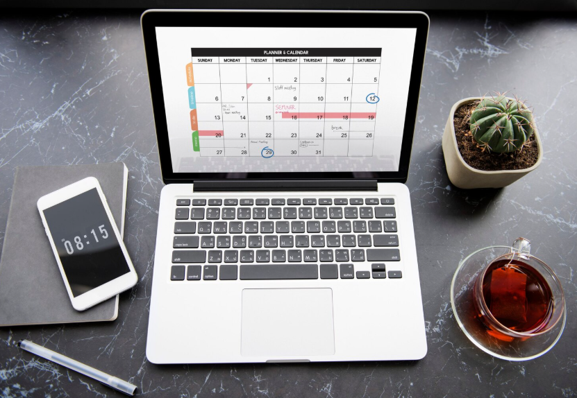 Laptop calendar shows how to rotate streaming services around monthly viewing plans.