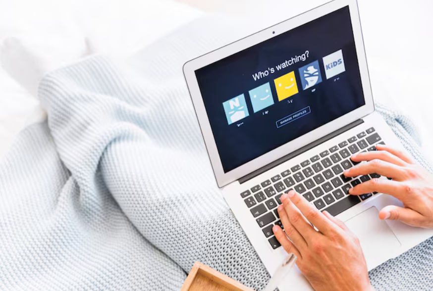 Laptop showing streaming profiles for viewers illustrating how to share streaming subscriptions legally.