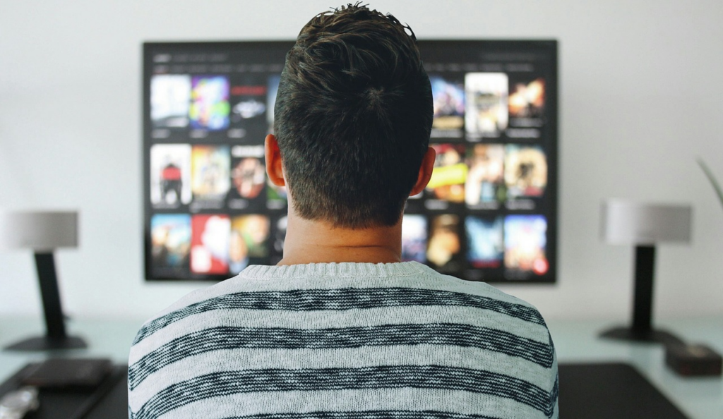 Viewer comparing Peacock vs Paramount Plus and other streaming options on a living room TV.