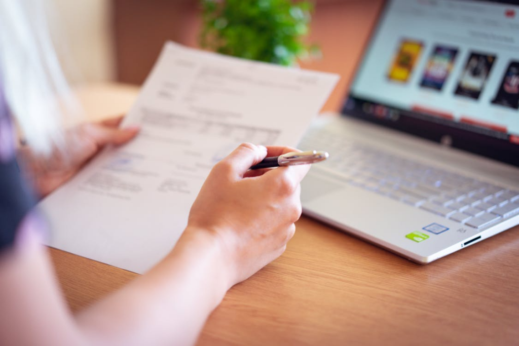 Person reviewing bills and streaming options to understand the true cost of cutting the cord.
