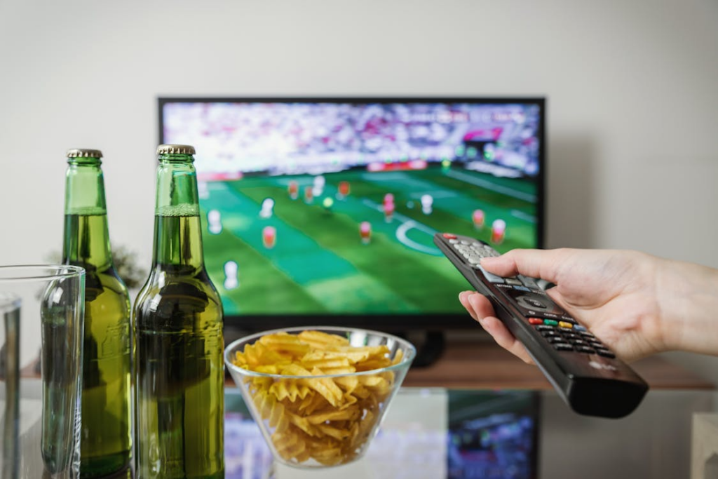 Watching live sports on TV while deciding when to keep cable instead of switching to streaming.