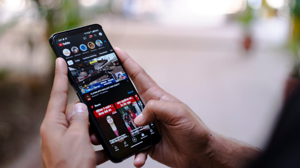 Viewer uses the best phone plans for TikTok and YouTube while watching videos on a phone.